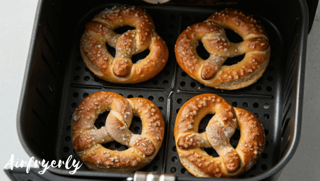 Frozen Super Pretzels placed in single layer inside air fryer basket before cooking