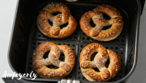 Frozen Super Pretzels placed in single layer inside air fryer basket before cooking
