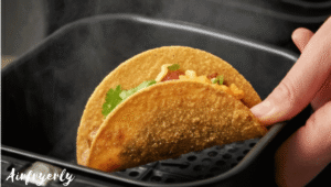 Holding crispy air fryer frozen mini tacos just after cooking