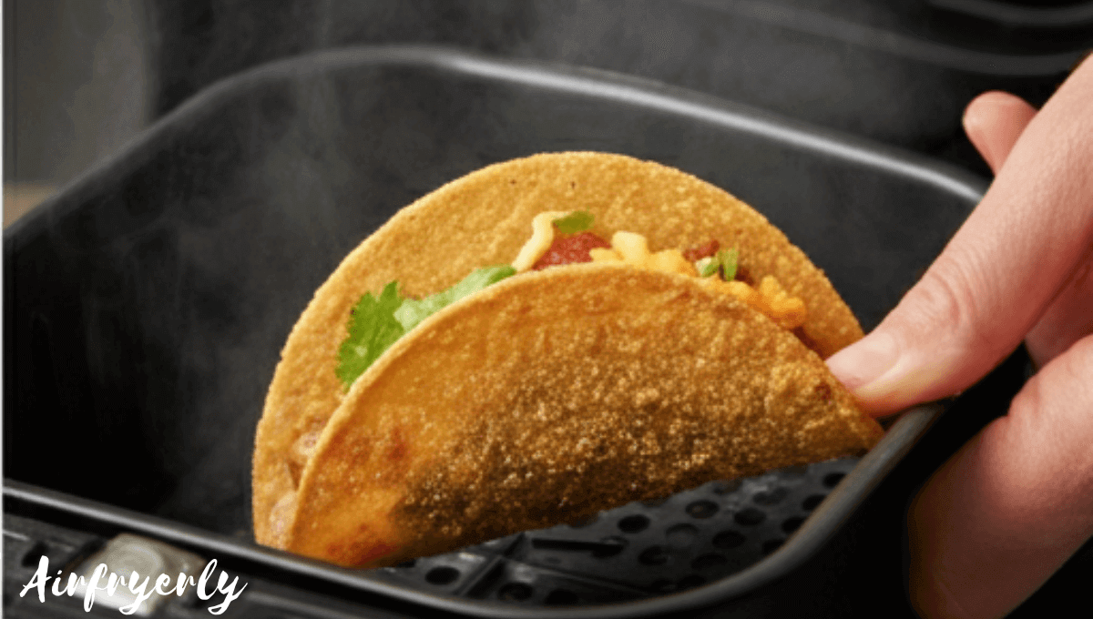 Holding crispy air fryer frozen mini tacos just after cooking