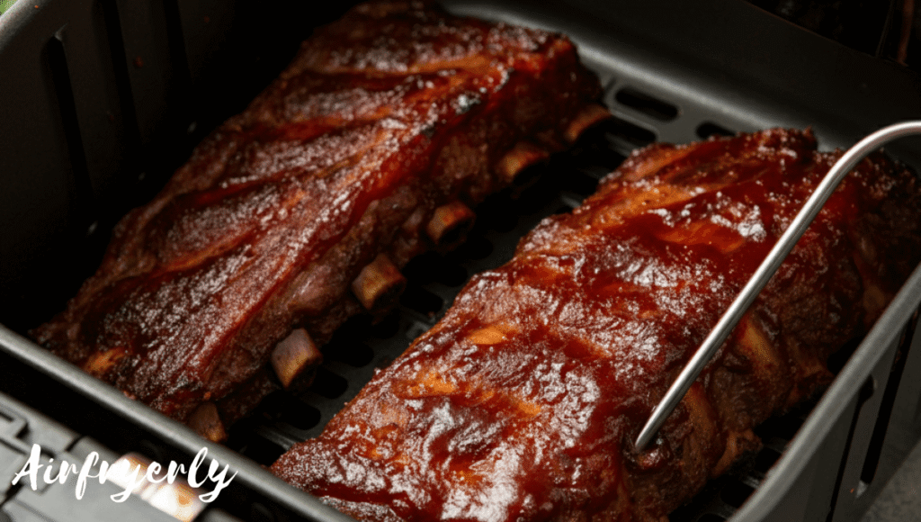"Cooked air fryer beef ribs with meat thermometer inserted showing 190°F – ideal internal temperature for tender ribs"
