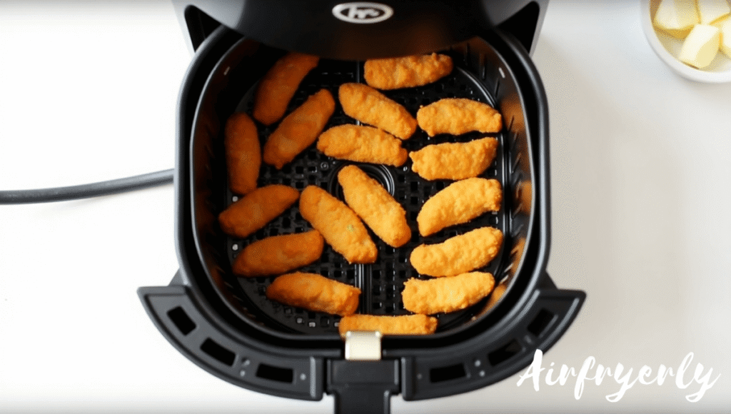 “Tyson Honey Breast Tenders cooking in the air fryer at 390°F, golden and crispy.”