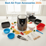 Best air fryer accessories including oil sprayer, rack, parchment paper, tongs, and baking pan on kitchen countertop